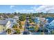 Charming neighborhood street view with colorful homes, palm trees, and well-manicured lawns at 186 Cayman Loop, Pawleys Island, SC 29585