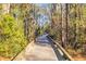 A community walkway lined with trees on either side provides a scenic walking experience at 186 Cayman Loop, Pawleys Island, SC 29585