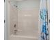 Bathroom features a shower with a refreshing, modern showerhead and decorative blue shower curtain at 2000 N Waccamaw Dr., Garden City Beach, SC 29576