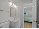 Bathroom features a vanity, toilet, modern lighting fixtures, and bright, neutral colors at 2000 N Waccamaw Dr., Garden City Beach, SC 29576