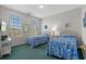 Inviting bedroom with two twin beds, bright windows, and tasteful decor at 2000 N Waccamaw Dr., Garden City Beach, SC 29576