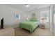 Bedroom with a TV, bright lighting, and coastal decor at 2000 N Waccamaw Dr., Garden City Beach, SC 29576