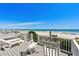 Outdoor deck offers comfortable seating, lounge chairs, and ocean views at 2000 N Waccamaw Dr., Garden City Beach, SC 29576