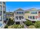 Aerial view of charming home with beach access, lush landscaping and stunning ocean views at 2000 N Waccamaw Dr., Garden City Beach, SC 29576