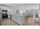 Bright open-concept kitchen flows into the dining and living areas with beach views at 2000 N Waccamaw Dr., Garden City Beach, SC 29576