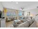 Comfortable living room featuring plush sofas, stylish decor, tile flooring, and beautiful ocean views at 2000 N Waccamaw Dr., Garden City Beach, SC 29576