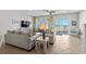 Cozy living room with comfortable seating, a ceiling fan, and sliding glass doors leading to the outside deck at 2000 N Waccamaw Dr., Garden City Beach, SC 29576