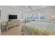 A main bedroom with a view of the ocean from its many windows and bright interior decor at 2000 N Waccamaw Dr., Garden City Beach, SC 29576
