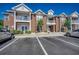 Brick condo building featuring multiple stories, white trim, and manicured landscaping at 2005 Silvercrest Dr. # 32-B, Myrtle Beach, SC 29579