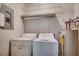 Laundry room with washer, dryer, water heater, and wire shelves at 2005 Silvercrest Dr. # 32-B, Myrtle Beach, SC 29579