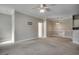 Open living area with ceiling fan, carpeted floor, and views of the dining area at 2005 Silvercrest Dr. # 32-B, Myrtle Beach, SC 29579