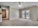 Spacious living room with ceiling fan and sliding glass doors at 2005 Silvercrest Dr. # 32-B, Myrtle Beach, SC 29579