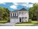 Charming two-story home featuring a double garage and a welcoming front porch at 2022 Lone Cypress Dr, Myrtle Beach, SC 29579
