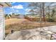 Spacious backyard featuring a storage shed, patio, and wooden fence, perfect for outdoor activities at 206 Balsa Dr., Longs, SC 29568