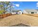 Expansive backyard enclosed by a wooden fence, providing privacy and ample space for outdoor activities at 206 Balsa Dr., Longs, SC 29568
