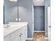 Well-lit bathroom with a white vanity, large mirror, and a neutral color scheme at 206 Balsa Dr., Longs, SC 29568
