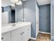 Well-lit bathroom with a white vanity, large mirror, and a neutral color scheme at 206 Balsa Dr., Longs, SC 29568