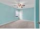 Bedroom with a window, ceiling fan, and an aqua color scheme at 206 Balsa Dr., Longs, SC 29568