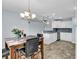 Charming dining area adjacent to a modern kitchen with stainless steel appliances at 206 Balsa Dr., Longs, SC 29568