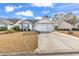 Charming single-story home with a well-manicured lawn and a spacious driveway at 206 Balsa Dr., Longs, SC 29568