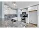 Bright kitchen with granite countertops, stainless steel appliances, and modern lighting at 206 Balsa Dr., Longs, SC 29568