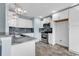 Modern kitchen featuring white cabinetry, stainless steel appliances, and stylish pendant lighting at 206 Balsa Dr., Longs, SC 29568