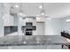 Modern kitchen featuring stainless steel appliances, gray backsplash and countertop, and pendant lighting at 206 Balsa Dr., Longs, SC 29568