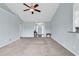 Open concept living room with light blue walls, neutral carpet, and ample natural light at 206 Balsa Dr., Longs, SC 29568
