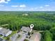 Aerial view of complex surrounded by a large, lush forest at 210 Portsmith Dr. # 2, Myrtle Beach, SC 29588