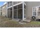 Inviting back porch with screened-in porch, perfect for relaxing and enjoying the outdoors at 210 Portsmith Dr. # 2, Myrtle Beach, SC 29588