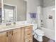 Bathroom featuring a white vanity and a shower-tub combination with a shower curtain at 210 Portsmith Dr. # 2, Myrtle Beach, SC 29588