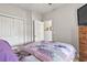 Comfortable bedroom features neutral walls, carpet, and a bed with a colorful quilt at 210 Portsmith Dr. # 2, Myrtle Beach, SC 29588