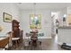 The dining area showcases hardwood flooring, modern lighting, and a seamless flow to the kitchen at 210 Portsmith Dr. # 2, Myrtle Beach, SC 29588