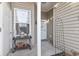 Inviting front porch with decorative table and potted plants, enhancing the home's curb appeal at 210 Portsmith Dr. # 2, Myrtle Beach, SC 29588