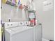 Well-equipped laundry area with a modern washer and dryer, shelving, and ample storage space at 210 Portsmith Dr. # 2, Myrtle Beach, SC 29588