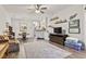 Open-concept living area featuring wood floors, light walls, and a seamless flow to the dining room at 210 Portsmith Dr. # 2, Myrtle Beach, SC 29588