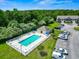 Aerial view of community pool with lounge chairs and lush landscaping, perfect for relaxation at 210 Portsmith Dr. # 2, Myrtle Beach, SC 29588