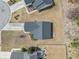 Aerial view showcases the home's roof, driveway, and proximity to neighboring houses and trees at 2288 Beauclair Ct., Myrtle Beach, SC 29579
