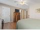 Bedroom featuring wood floors, a ceiling fan, neutral paint, and ensuite bathroom at 2288 Beauclair Ct., Myrtle Beach, SC 29579