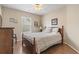 Bedroom with a window and ceiling fan, featuring wood floors at 2288 Beauclair Ct., Myrtle Beach, SC 29579