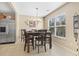 Bright dining area features stainless steel fridge and a large window with natural light at 2288 Beauclair Ct., Myrtle Beach, SC 29579