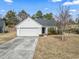 Charming single-story home with a well-manicured lawn and attached garage at 2288 Beauclair Ct., Myrtle Beach, SC 29579