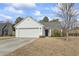 Inviting one-story home with a two-car garage, manicured bushes, and a well-maintained lawn at 2288 Beauclair Ct., Myrtle Beach, SC 29579