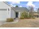 Close-up view of home's front door and well landscaped walkway and front yard at 2288 Beauclair Ct., Myrtle Beach, SC 29579