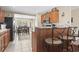 Kitchen area with barstool seating and views of the adjacent dining area at 2288 Beauclair Ct., Myrtle Beach, SC 29579