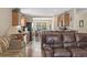 Open-concept living area flowing from the kitchen with wood cabinets and tile floors at 2288 Beauclair Ct., Myrtle Beach, SC 29579