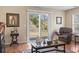 Cozy living room with sliding glass doors leading to the backyard, providing natural light and access at 2288 Beauclair Ct., Myrtle Beach, SC 29579