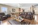 Open-concept living space with hardwood floors, neutral paint, and a view into the kitchen at 2288 Beauclair Ct., Myrtle Beach, SC 29579