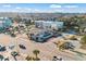 Aerial view of apartment building with pool, street, and beach access at 2600 S Ocean Blvd. # 101, Myrtle Beach, SC 29577