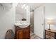 Bathroom featuring updated vanity and lighting, plus ensuite bathroom access from the main bedroom at 2600 S Ocean Blvd. # 101, Myrtle Beach, SC 29577